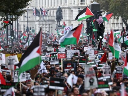 People take part in a 'March For Palestine', in London on October 21, 2023, to "demand an